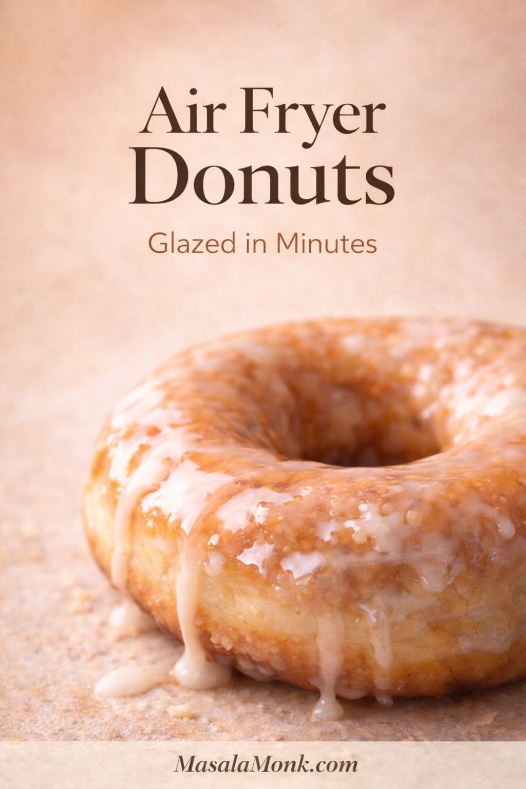 Portrait cover image of a glossy glazed air fryer donut close-up on a warm beige background with text “Air Fryer Donuts” and “Glazed in Minutes,” MasalaMonk.com in the footer.