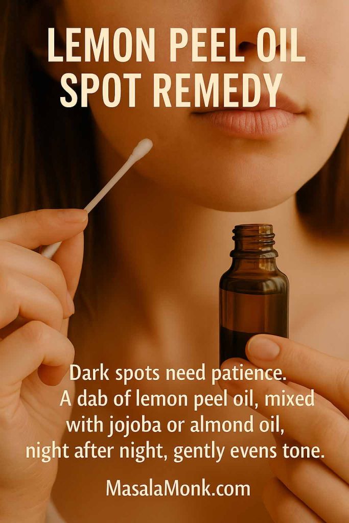 "Close-up of a woman applying lemon peel oil with a cotton bud for dark spot treatment – MasalaMonk.com"