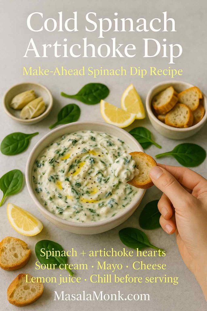 Cold spinach artichoke dip in a light ceramic bowl with a hand holding a crostini scoop, surrounded by lemon wedges, spinach leaves, artichoke hearts, and toasted baguette slices on a pale stone surface, with mini recipe text overlay.