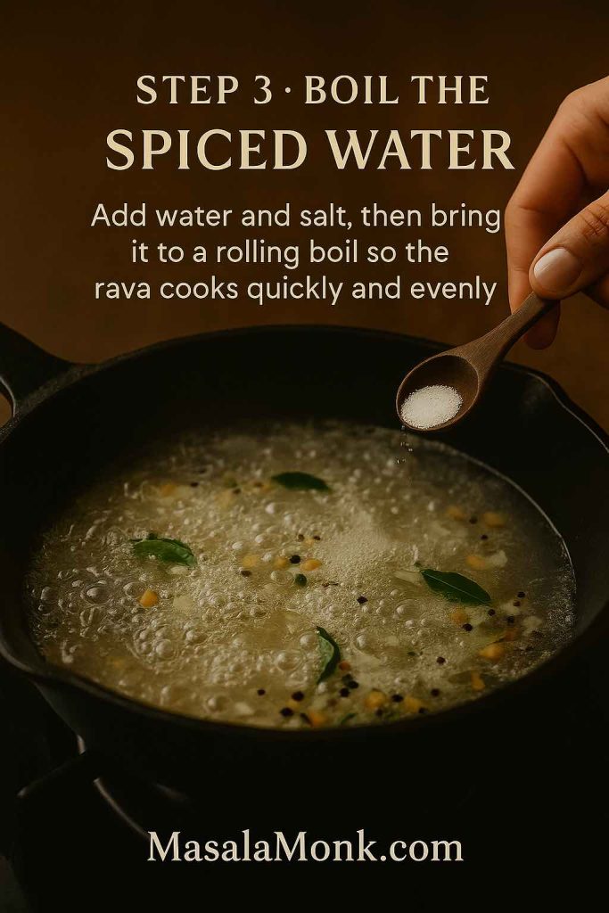 Step 3 of the rava upma recipe showing a cast-iron skillet of spiced water at a rolling boil with curry leaves and lentils, while a hand sprinkles salt from a wooden spoon, with text explaining to boil the water so the rava cooks quickly and evenly.