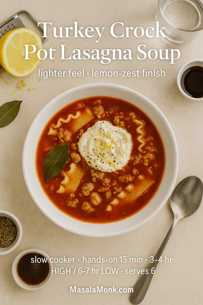 Light turkey lasagna soup in a white bowl with tomato broth, ruffled noodles, lemon-zest ricotta, bay leaf, and cracked pepper; overhead.