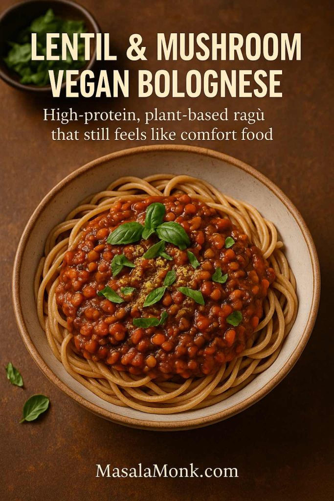 Portrait image of a bowl of wholegrain spaghetti topped with a rich lentil and mushroom vegan bolognese, garnished with basil and nutritional yeast, with text reading “Lentil & Mushroom Vegan Bolognese – High-protein, plant-based ragù that still feels like comfort food”.