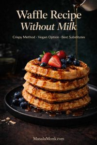 Dark green luxe magazine cover showing a tall stack of golden waffles without milk on a black plate with maple syrup pouring from above, topped with strawberries and blueberries, with text overlay “Waffle Recipe Without Milk” and “Crispy Method • Vegan Option • Best Substitutes,” plus MasalaMonk.com in the footer.