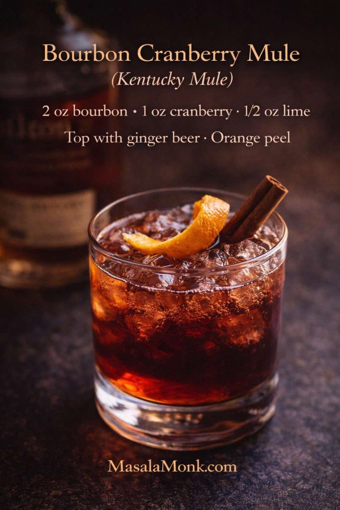 Bourbon cranberry mule (Kentucky mule) in a rocks glass with orange peel and cinnamon, with an on-image recipe using bourbon, cranberry juice, lime, and ginger beer.