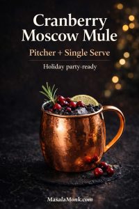 Cranberry Moscow Mule in a copper mug garnished with rosemary, cranberries, and lime, with text “Pitcher + Single Serve” and “Holiday party-ready.”