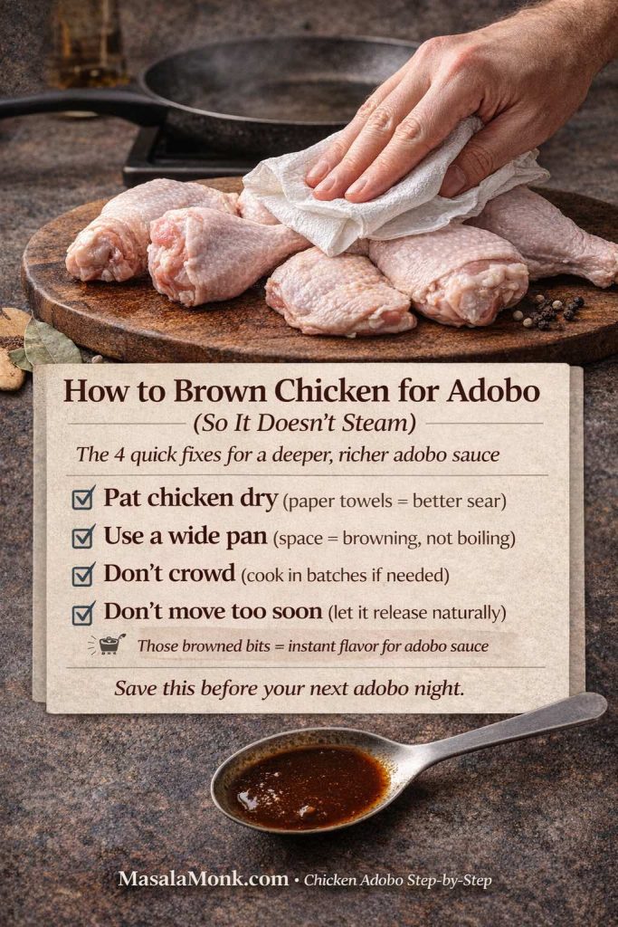 Infographic showing how to brown chicken for adobo so it doesn’t steam. Photo shows hands patting raw chicken pieces dry with a paper towel on a wooden board, with a wide pan heating in the background. Text overlay lists four tips: pat chicken dry, use a wide pan, don’t crowd (cook in batches), and don’t move too soon (let it release naturally). Note says browned bits add instant flavor for adobo sauce, with MasalaMonk.com in the footer.