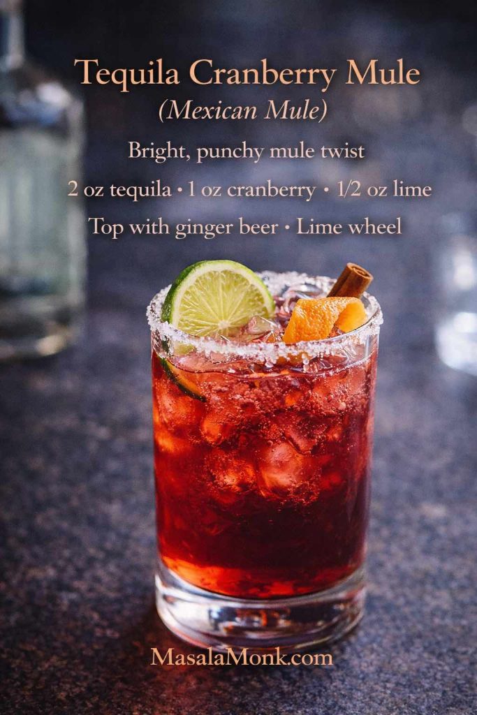 Tequila cranberry mule (Mexican mule) in a tall glass with a salt-sugar rim, lime wheel, and orange peel, with an on-image recipe using tequila, cranberry, lime, and ginger beer.