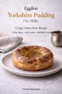 Eggless Yorkshire pudding made without milk on a plate, showing a golden, crisp rim and hollow center—dairy-free Yorkshire pudding recipe cover image.