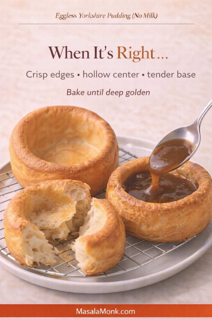 Three eggless Yorkshire puddings made without milk on a cooling rack: one whole with tall crisp walls, one torn open to show a hollow center, and one being filled with gravy; text overlay reads “When It’s Right… Crisp edges • hollow center • tender base” and “Bake until deep golden,” with MasalaMonk.com in the footer.