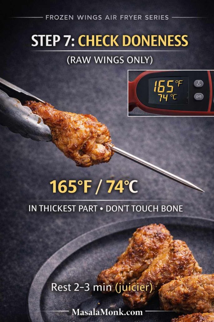 Step 7 “Check Doneness” graphic for frozen chicken wings in an air fryer: a cooked wing held with tongs while an instant-read thermometer probes the thickest part of a drumette. The display shows 165°F / 74°C with the note “don’t touch bone” and “rest 2–3 min,” plus MasalaMonk.com in the footer.