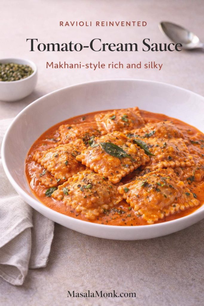 Ravioli in a creamy tomato-cream makhani-style sauce in a white bowl, garnished with curry leaves and dried fenugreek, with text overlay “Tomato-Cream Sauce” and “Makhani-style rich and silky,” plus MasalaMonk.com in the footer.