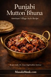 Punjabi mutton bhuna in a brass kadhai with thick reduced onion-tomato masala, styled as an Amritsari village-style recipe cover image with MasalaMonk branding