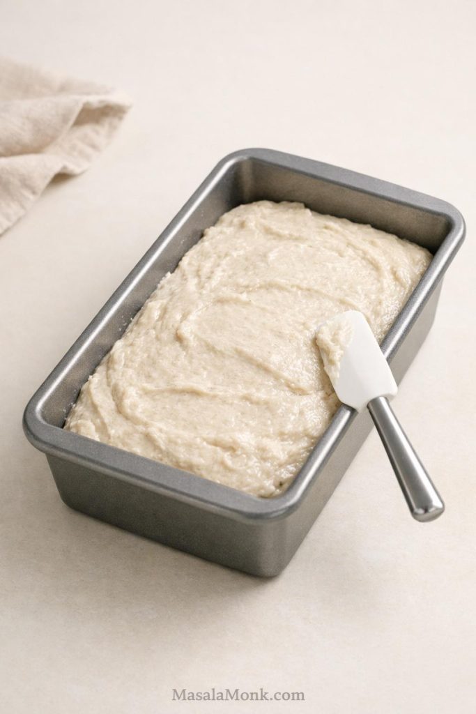 Gluten free sourdough dough smoothed into a loaf pan before final proof.