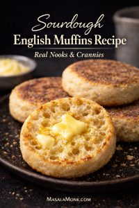 Fork-split sourdough English muffin with melted butter showing real nooks and crannies, styled as a dark editorial recipe cover with text overlay.