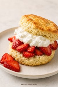 Classic strawberry shortcake recipe with biscuit-style shortcake, fresh strawberries, and soft whipped cream on a plate
