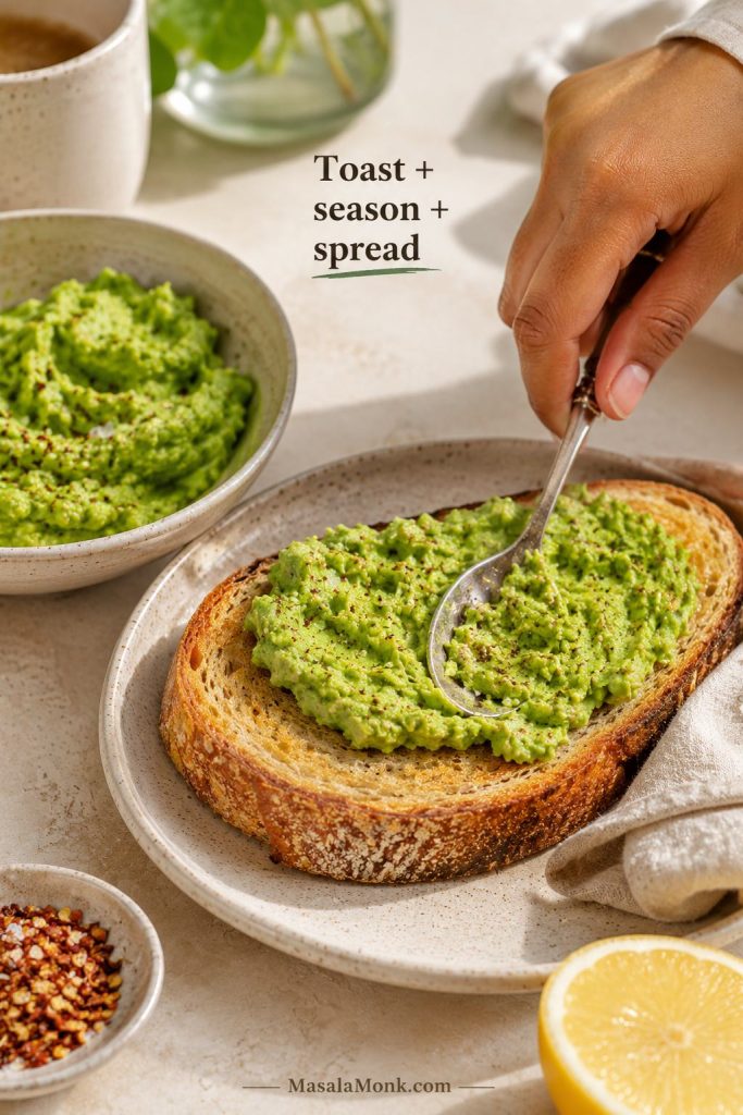 Avocado toast process scene with crisp toast, seasoned avocado mash, and avocado being spread onto bread.