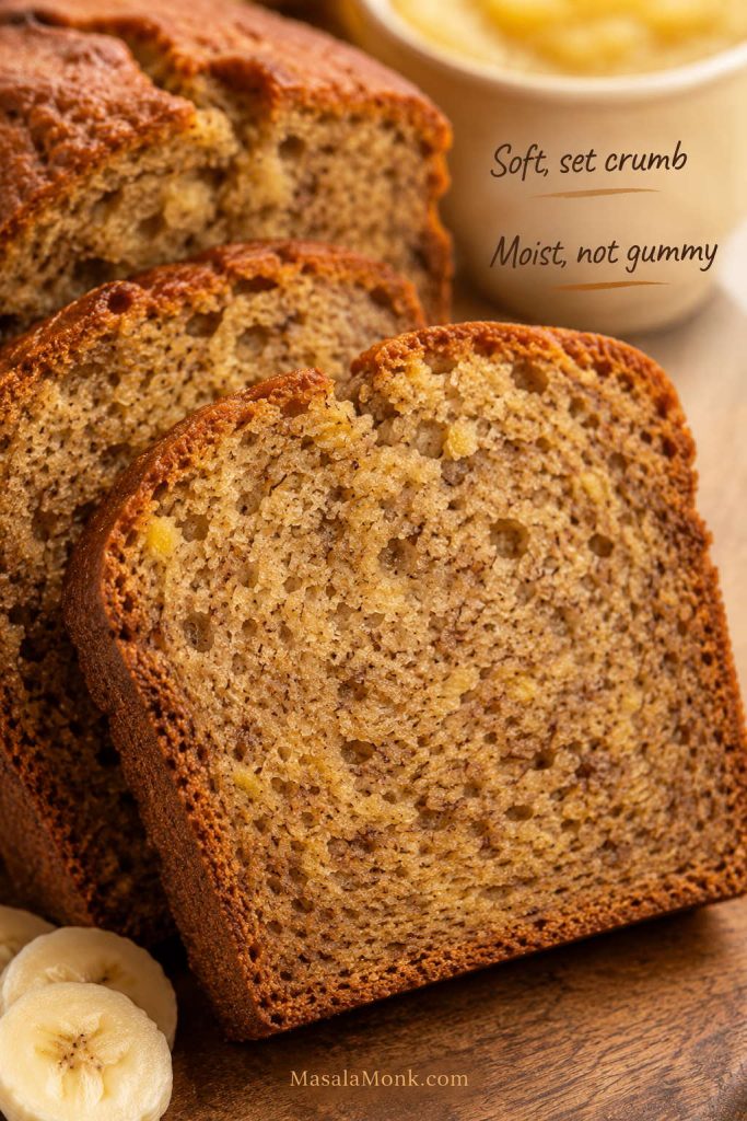 Close-up of banana bread slices showing an even, moist crumb with no gummy center or shiny wet line.