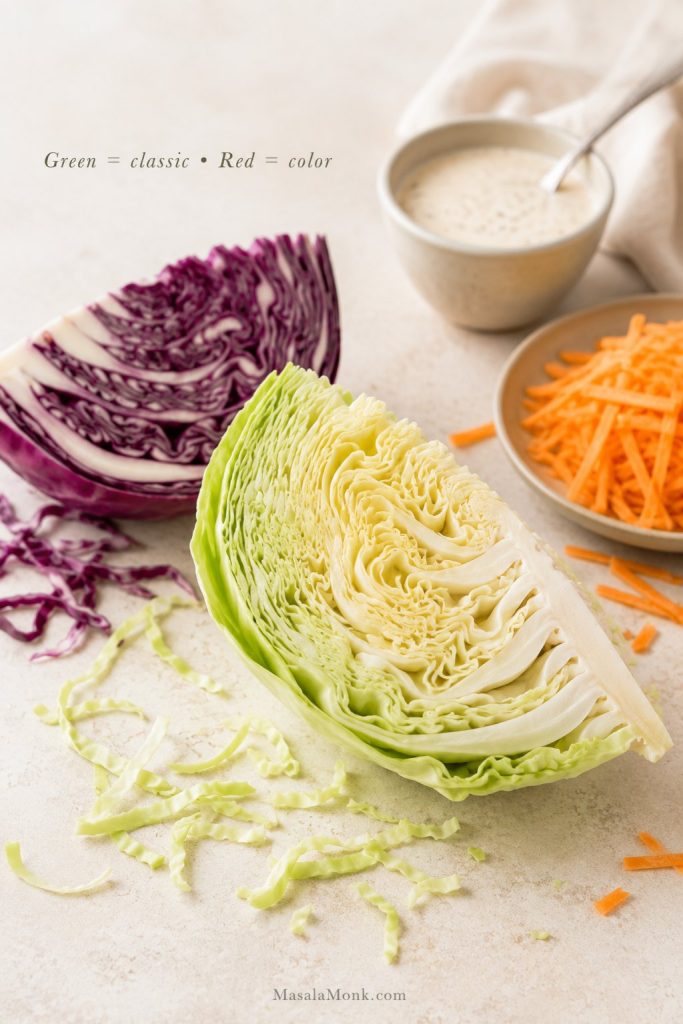 Green cabbage, red cabbage, carrots, and creamy dressing arranged for making coleslaw.