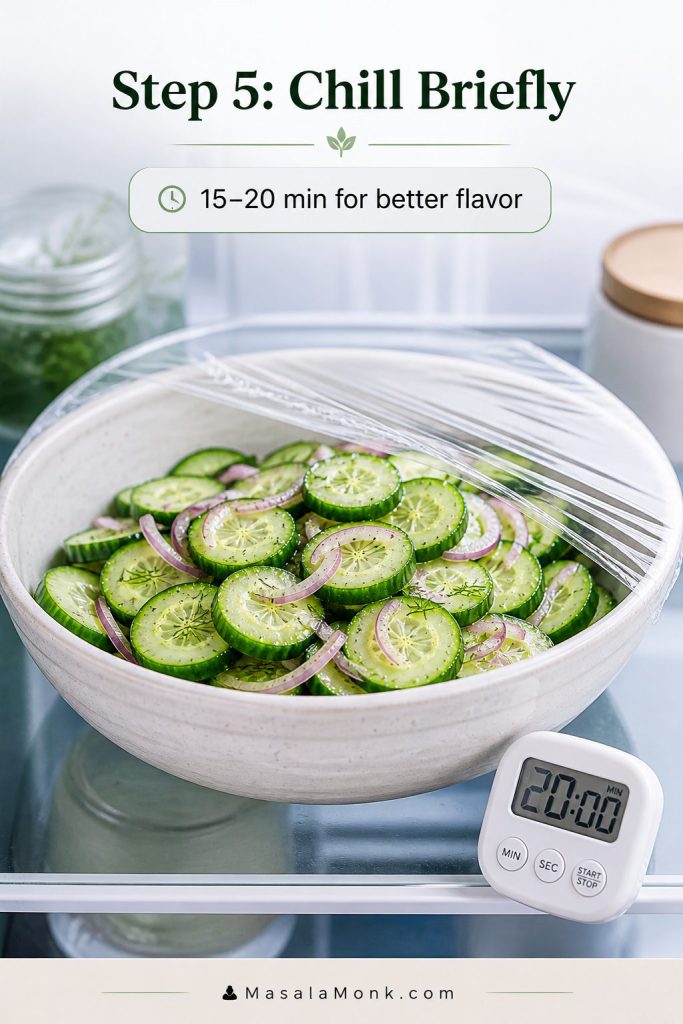 Bowl of cucumber salad chilling briefly with a 15 to 20 minute timing cue.