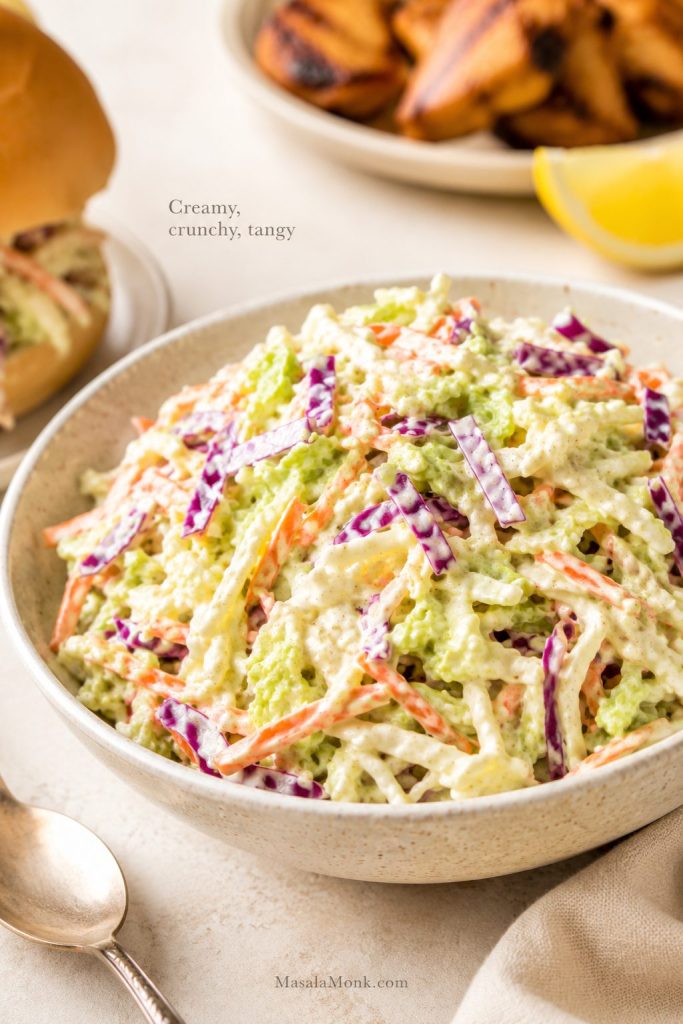 Easy creamy coleslaw recipe served as a cold crunchy BBQ side with cabbage, carrots, and creamy dressing.