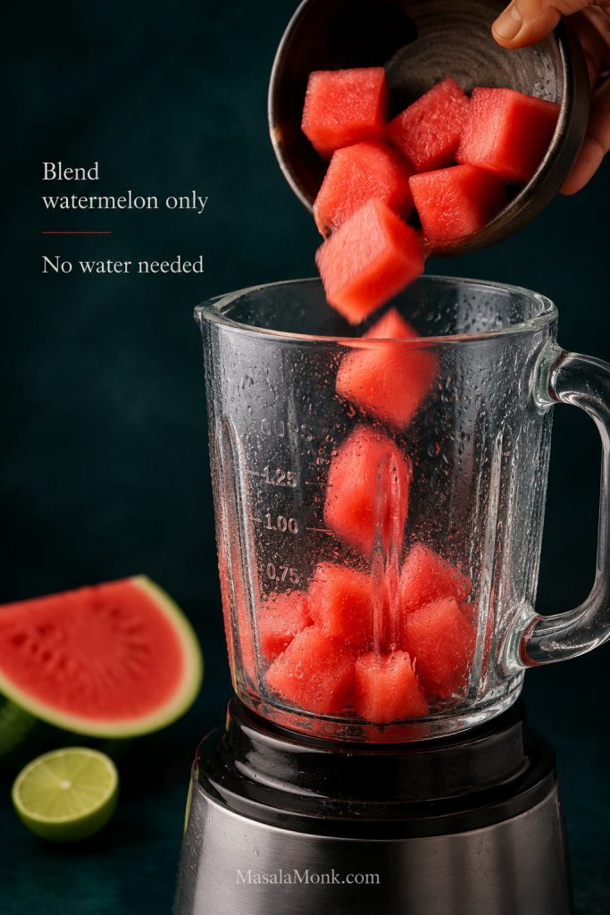 Watermelon cubes being blended and strained to make fresh juice for watermelon margaritas.