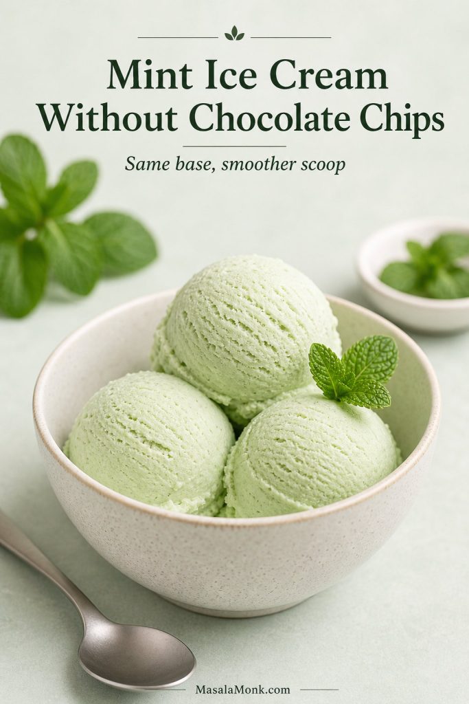 Plain mint ice cream without chocolate chips served as smooth pale green scoops in a bowl with mint garnish.