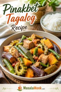 Bowl of Pinakbet Tagalog with pork, squash, okra, eggplant, ampalaya, long beans, and tomato-bagoong sauce, served with rice nearby.