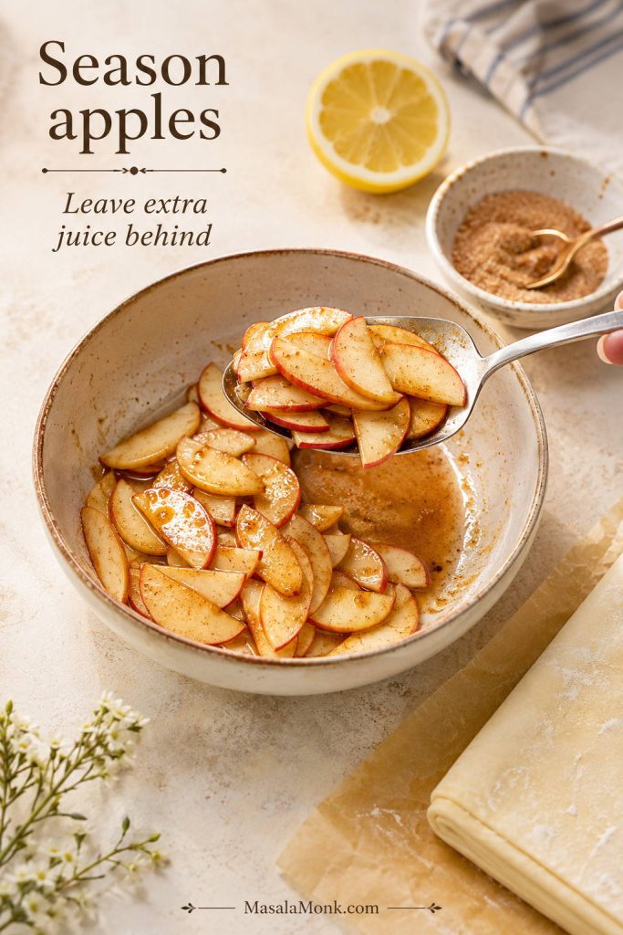 Thin apple slices tossed with cinnamon sugar and lemon juice, with extra liquid left in the bowl.