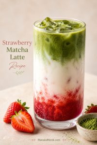 Tall iced strawberry matcha latte in a clear glass with red strawberry base, cold milk, green matcha, ice, strawberries, and matcha powder nearby.