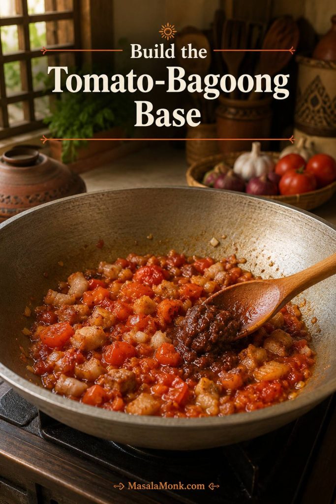 Pork, onion, garlic, softened tomatoes, and bagoong being stirred together in a wide pan for Pinakbet Tagalog.