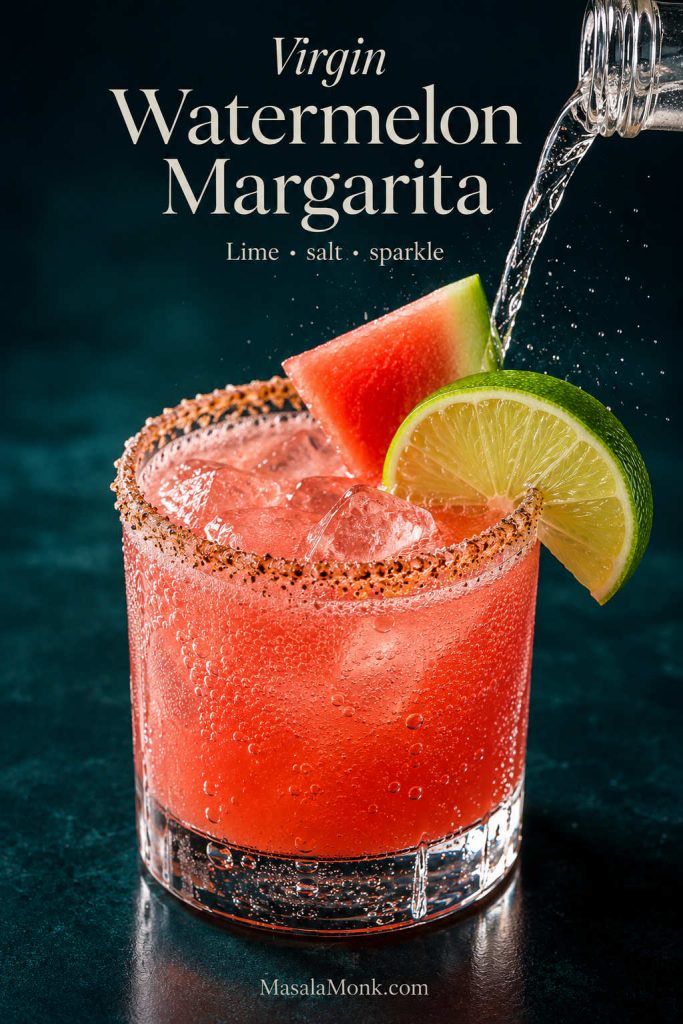 Virgin watermelon margarita with sparkling bubbles, lime, watermelon garnish, and a seasoned rim.