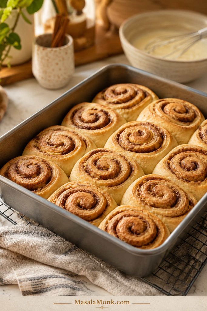 Baked cinnamon rolls before icing with lightly golden tops