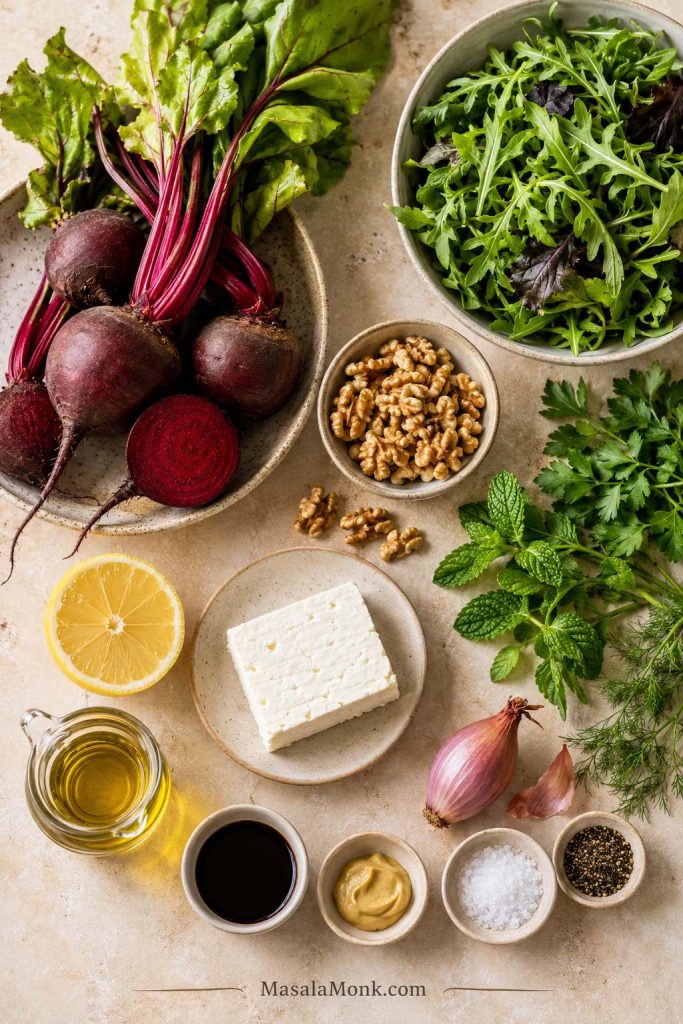 Raw beets, feta, walnuts, greens, herbs, lemon, balsamic vinegar, Dijon mustard, olive oil, salt, and pepper.