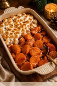 Classic candied yams should show tender orange slices, not mashed sweet potatoes. Keeping one side plain and one side topped with marshmallows is an easy way to satisfy both holiday-table preferences.