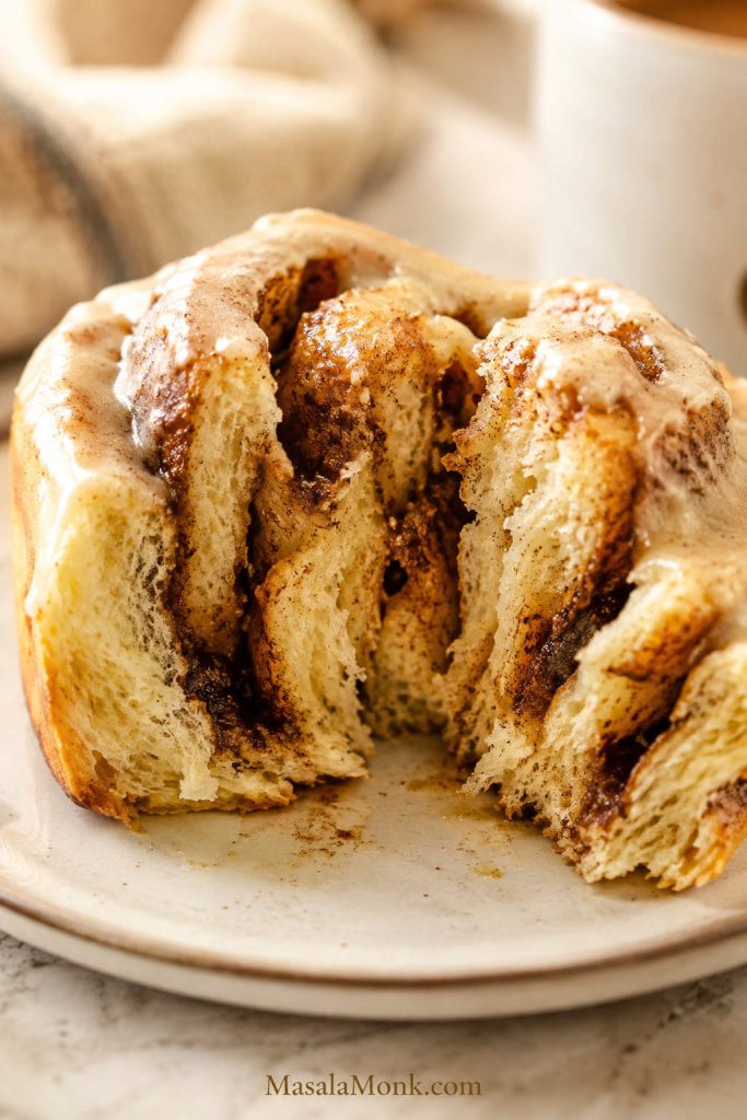 Cinnamon roll center showing a baked interior with gooey cinnamon swirl