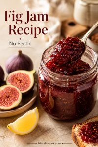 Open jar of homemade fig jam with a spoon lifting glossy no-pectin jam, fresh halved figs, lemon, and toast nearby.