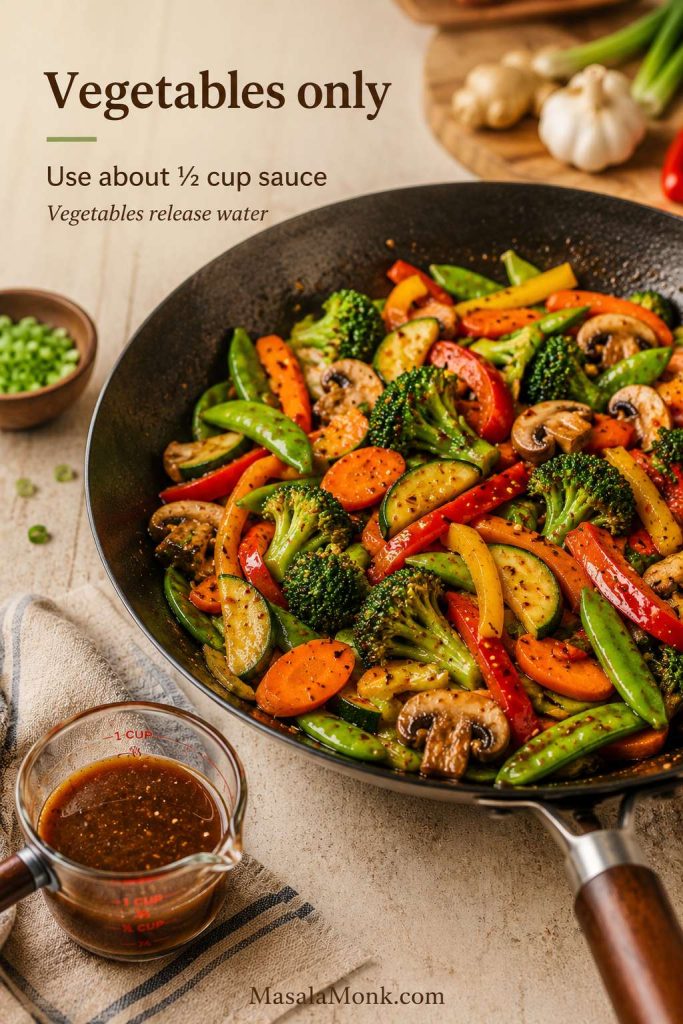 Colorful vegetable stir-fry with broccoli, peppers, carrots, mushrooms, snap peas, zucchini, and a measuring cup of sauce, with text reading “Vegetables only” and “Use about ½ cup sauce.”