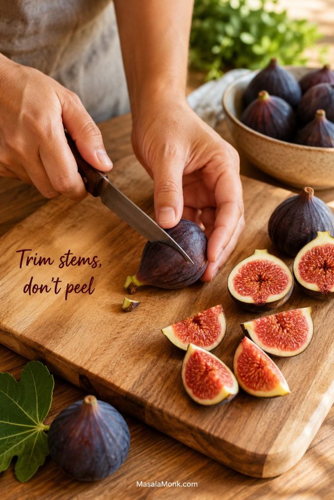 Hands trimming stems and quartering fresh figs on a cutting board for homemade jam.
