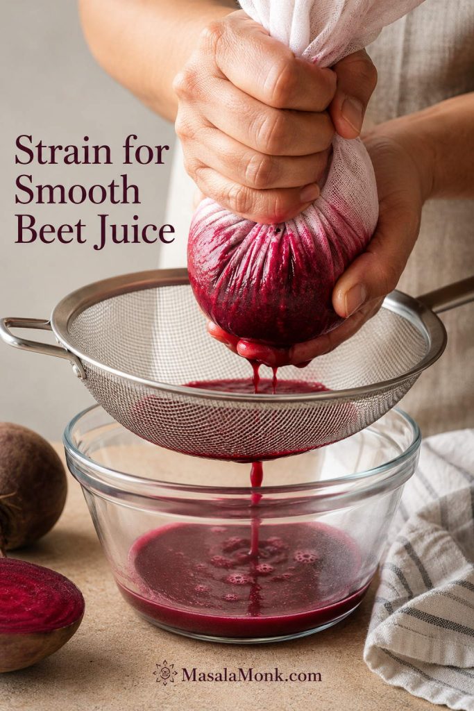 Close-up of hands straining blended beet juice through a nut milk bag or fine mesh strainer into a bowl.