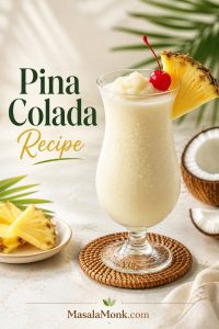 Frozen pina colada in a hurricane glass with a pineapple wedge, cherry garnish, coconut pieces, and MasalaMonk.com footer branding.