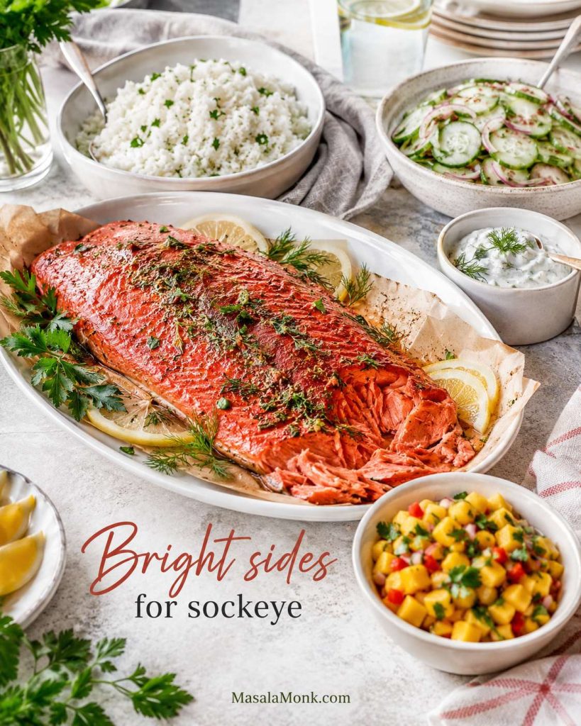 Baked sockeye salmon served with rice, cucumber salad, mango salsa, yogurt sauce, lemon, and herbs.