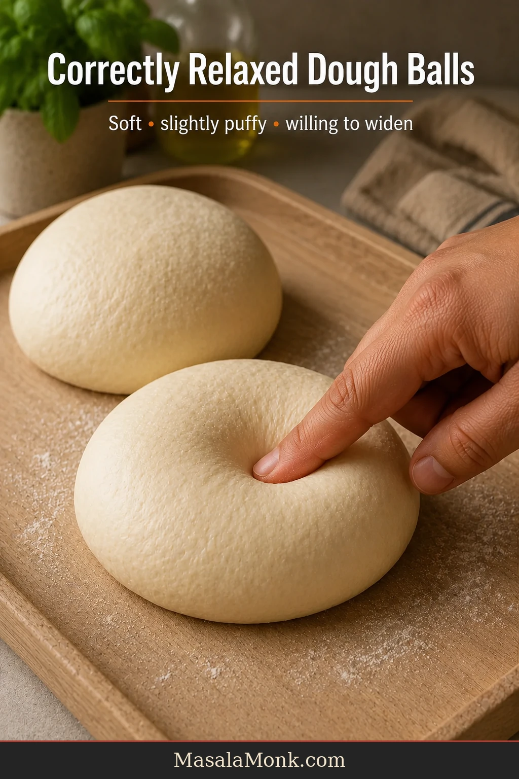 Two soft slightly puffy pizza dough balls resting on a work surface while one is gently pressed with a fingertip.