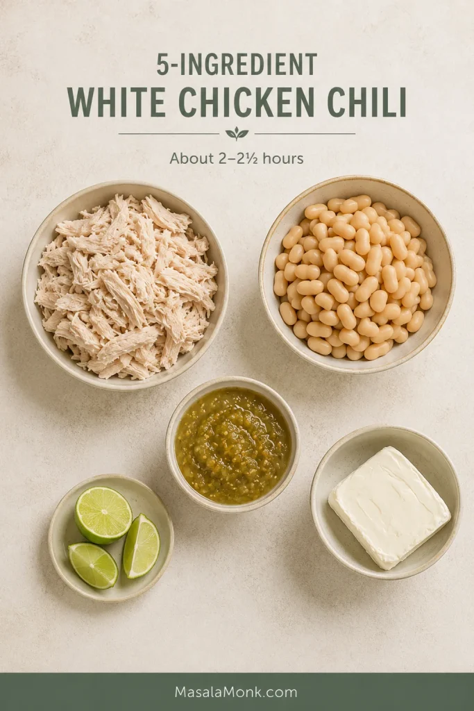 Cooked chicken, white beans, salsa verde, cream cheese and lime arranged as the five ingredients for shortcut white chicken chili.