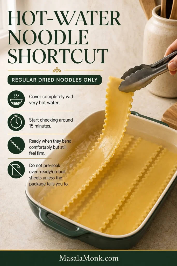 Regular dried lasagna noodles soaking in hot water while one softened but still firm ruffled sheet is lifted with tongs.