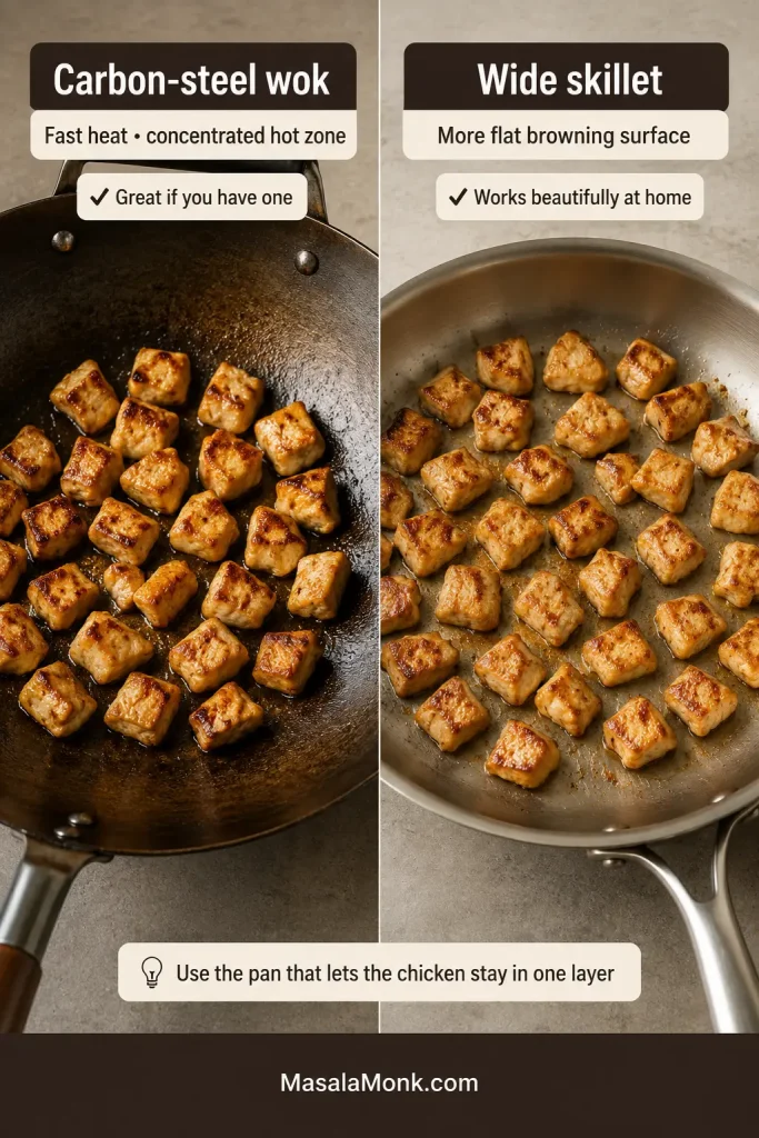 Browned chicken cooking in a carbon-steel wok beside an equally browned batch in a wide stainless-steel skillet.