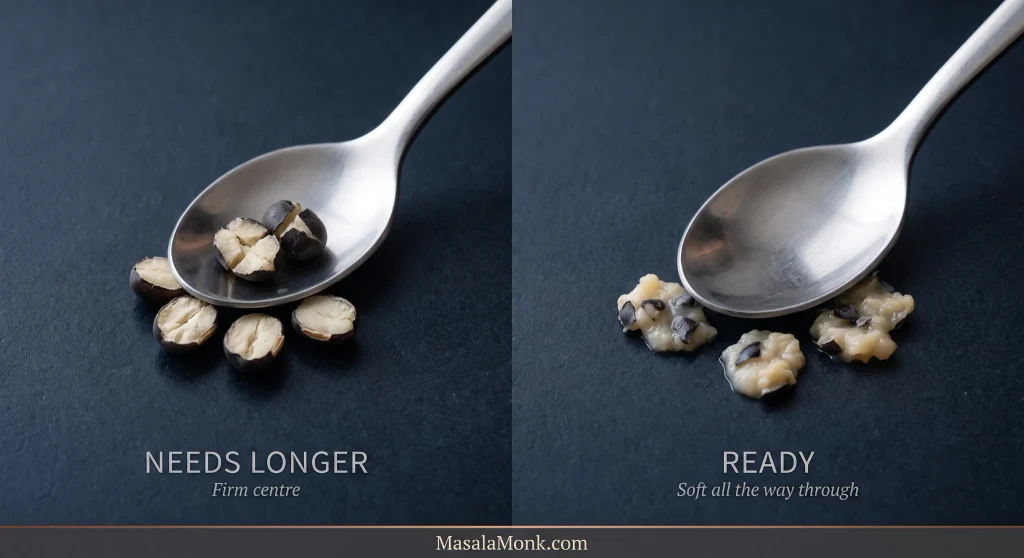 Side-by-side whole black urad tenderness test with a metal spoon: on the left, grains labelled ‘Needs Longer’ remain cracked but firm inside; on the right, grains labelled ‘Ready’ crush into soft creamy mash with pieces of black skin.