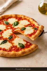 Homemade Margherita pizza with one slice gently lifted on a server, showing a slight bend, browned crust, tomato, mozzarella and fresh basil.