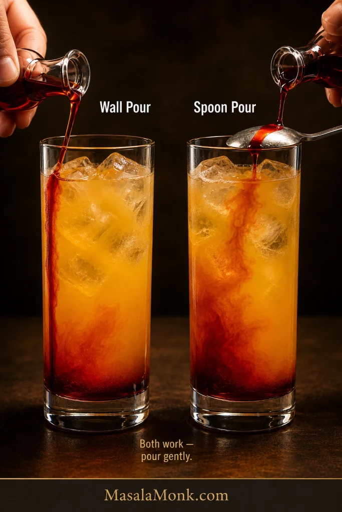 Grenadine is added to two highball glasses, once down the inside wall and once over the convex back of an upside-down spoon.