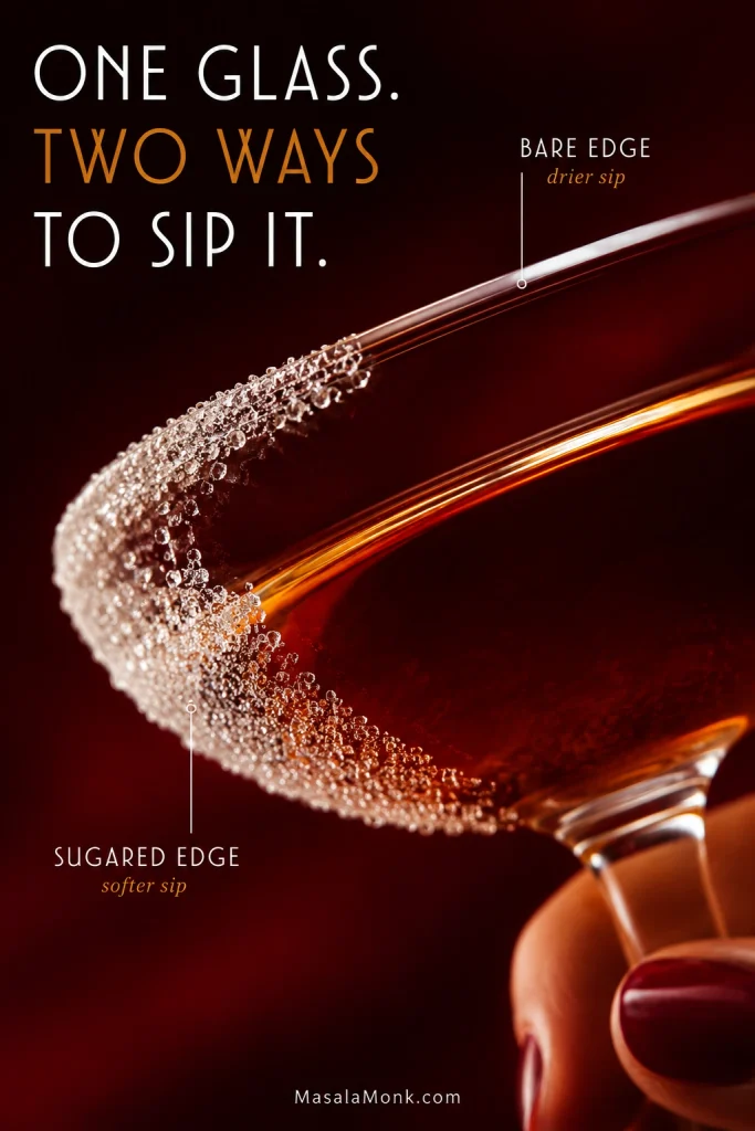 Close-up of one Sidecar glass with half the rim sugared and half left bare, labeled for a softer sip and a drier sip.