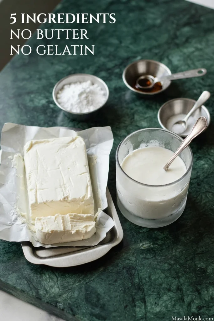 Cream cheese, cold heavy whipping cream, powdered sugar, vanilla and salt arranged as the five ingredients for whipped cream cheese frosting.
